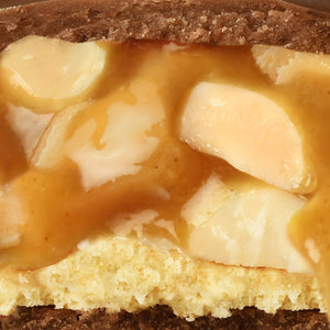 A close up showing goey peanuts in caramell