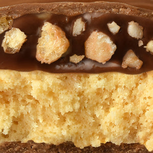 A cross section image showing goey nougat with pieces of crisps