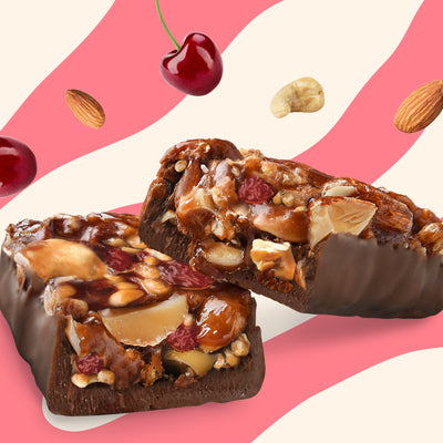 Box of N!CK'S Cherry Crunch Nut Bars, 12 count, labeled 'keto friendly' and 'no added sugar'.