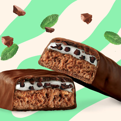Box of N!CK'S Mint Chocolate Protein Bars (12-pack), with an unwrapped bar showing the interior layers. Highlights 16g protein and "no added sugar" for a keto snack.