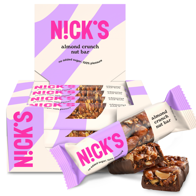 Box of N!CK'S Almond Crunch Nut Bars (12-pack), with a bar unwrapped to show the whole almonds and filling. Highlights "no added sugar" and "100% pleasure."