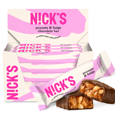 Packaging of Nick's Peanuts & Fudge chocolate bars with one bar partially unwrapped to display the product inside.